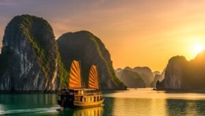 Explore Lan Ha’s Majestic Waters with limestone karsts and emerald water at sunset.