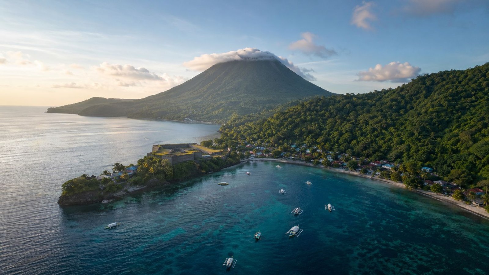 Banda Islands travel guide featuring Gunung Api volcano and crystal clear sea